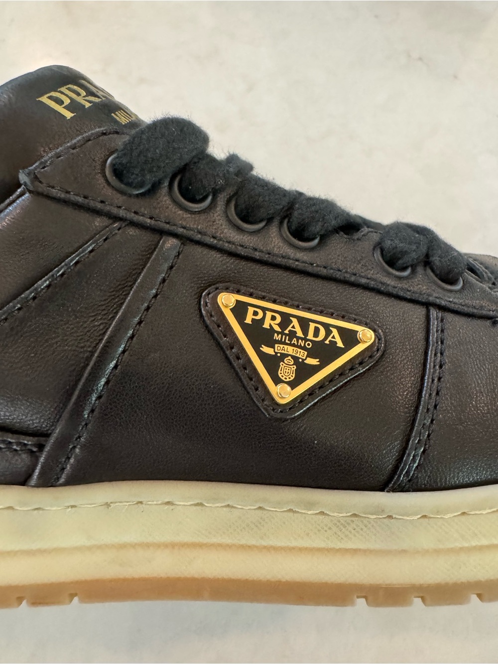 Prada Black Leather Sneakers with White Laces and Gum Sole